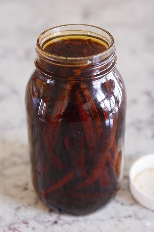 Vanilla beans soaking in a mason jar.