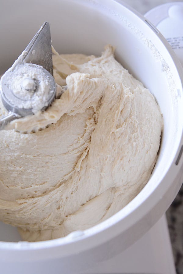 Inside of a Bosch bowl mixing bread dough.