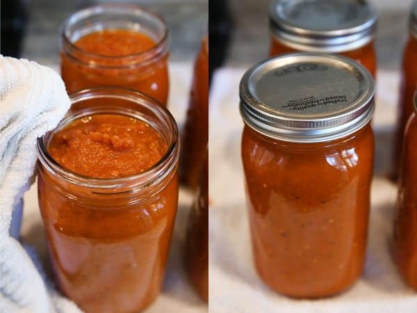 Wiping edge of jar and putting on lids and rings for homemade canned spaghetti sauce recipe.