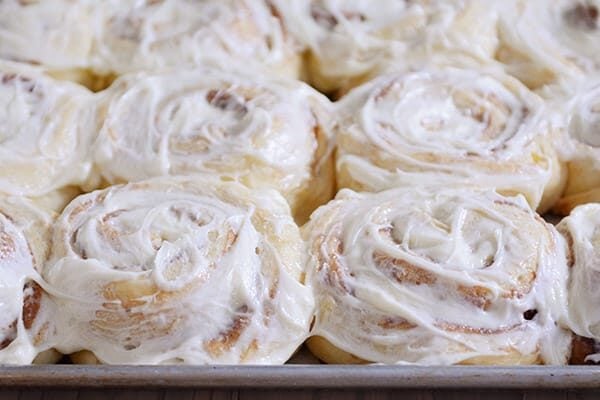A pan of frosted cinnamon rolls.